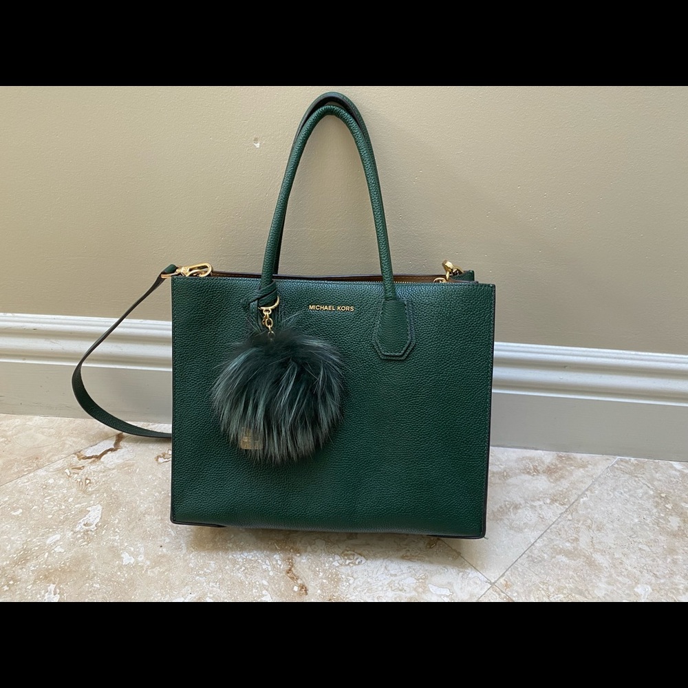 Never been used green Michael Kors bag with poof keychain